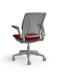 Humanscale World Chair with black mesh, gray frame, Parma Red fabric seat, back view. Kansas City Office Design