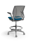 Humanscale World Stool with black mesh, gray frame, peacock blue fabric seat, back view. Kansas City Office Design
