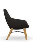 Side view of the 9to5 Lilly lounge chair in maple wood leg frame and black vinyl Fabric. Kansas City Office Design