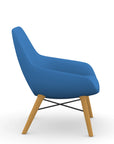 Side view of the 9to5 Lilly lounge chair in maple wood leg frame and blue Fabric. Kansas City Office Design