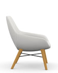 Side view of the 9to5 Lilly lounge chair in maple wood leg frame and tinsel vinyl Fabric. Kansas City Office Design