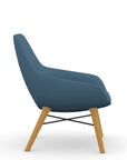 Side view of the 9to5 Lilly lounge chair in maple wood leg frame and wave vinyl Fabric. Kansas City Office Design