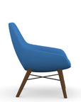 Side view of the 9to5 Lilly lounge chair in walnut wood leg frame and blue Fabric. Kansas City Office Design
