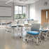 Modern classroom with desks and SitOnIt Movi nesting chairs in a well-lit room. Kansas City Office Design.