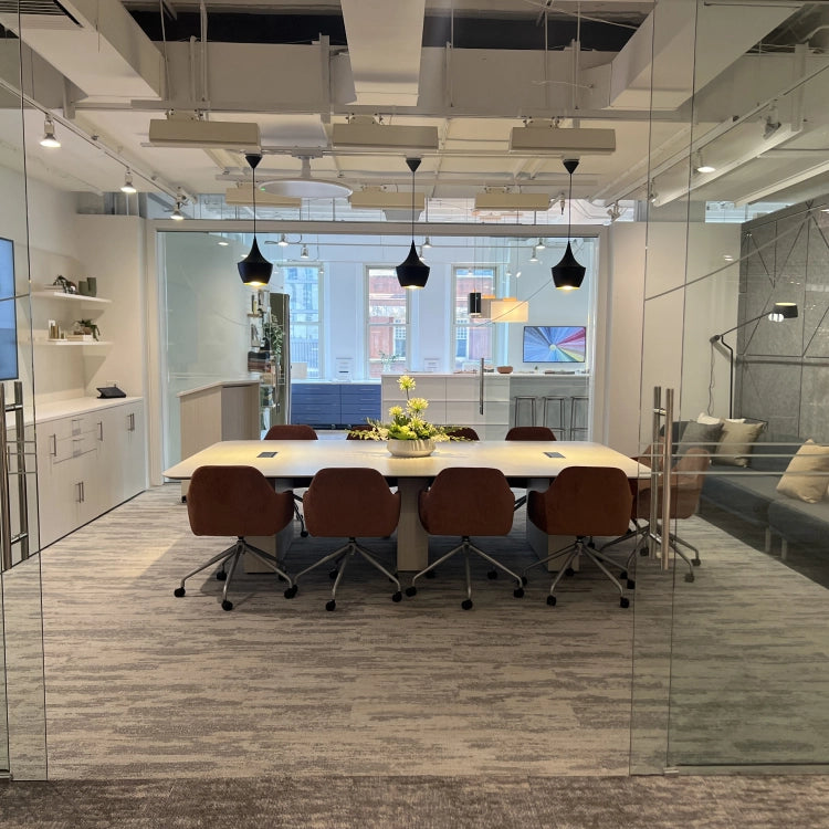 Modern office conference room with a long table and chairs. Kansas City Office Design.
