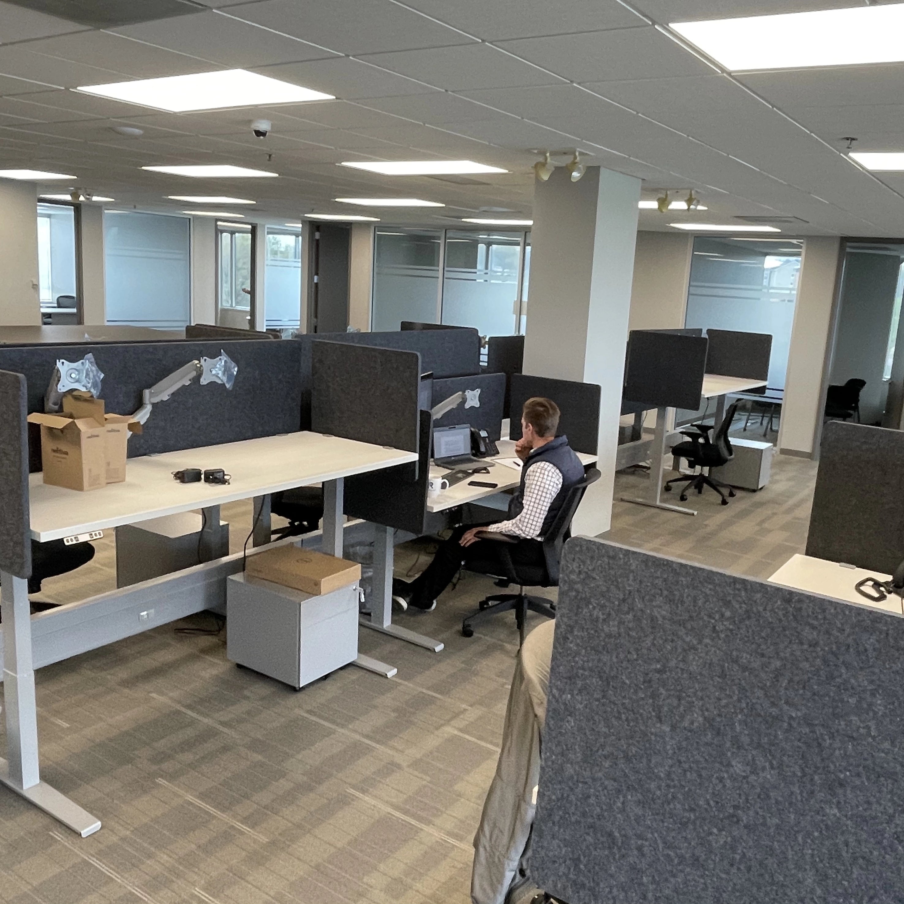 Post and Beam workstations with sit to stand height adjustable desks. Kansas City Office Design.