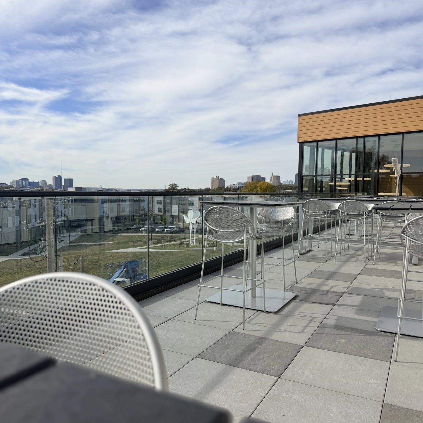 Install of outdoor chairs, table, and umbrella. Furniture from: Grand Rapids Chair & Beaufurn. Kansas City Office Design.