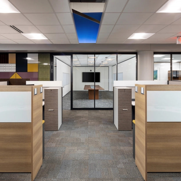 Modern office with wooden cubicles and glass partitions. Kansas City Office Design