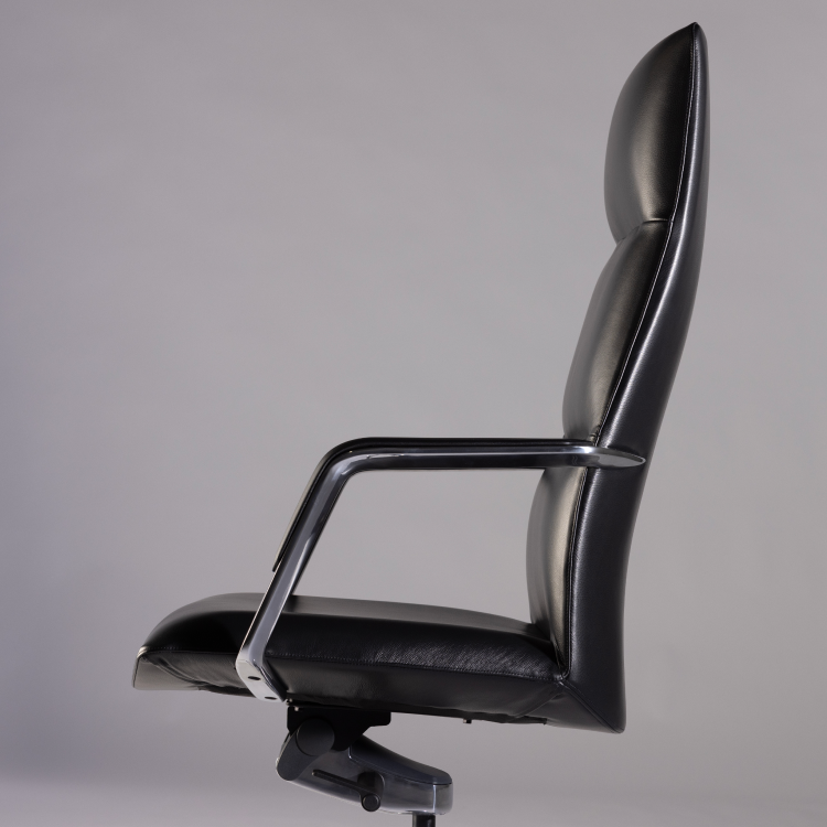 Black office chair on a gray background. Kansas City Office Design