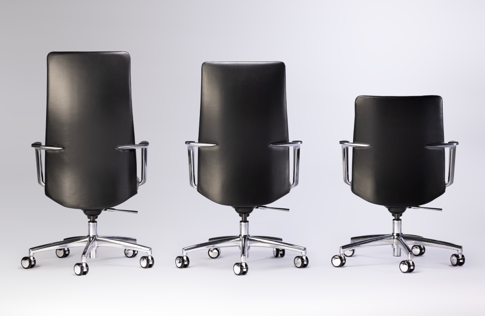 Three black office chairs with chrome frames on a white background. Kansas City Office Design