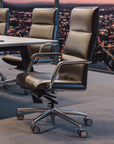 Leather office chairs in a conference room with a cityscape view. Kansas City Office Design