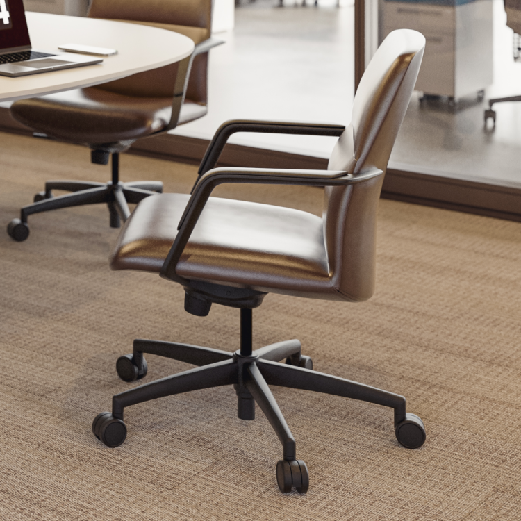Brown office chair with white cushion in a modern office setting. Kansas City Office Design