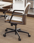 Brown office chair with white cushion in a modern office setting. Kansas City Office Design