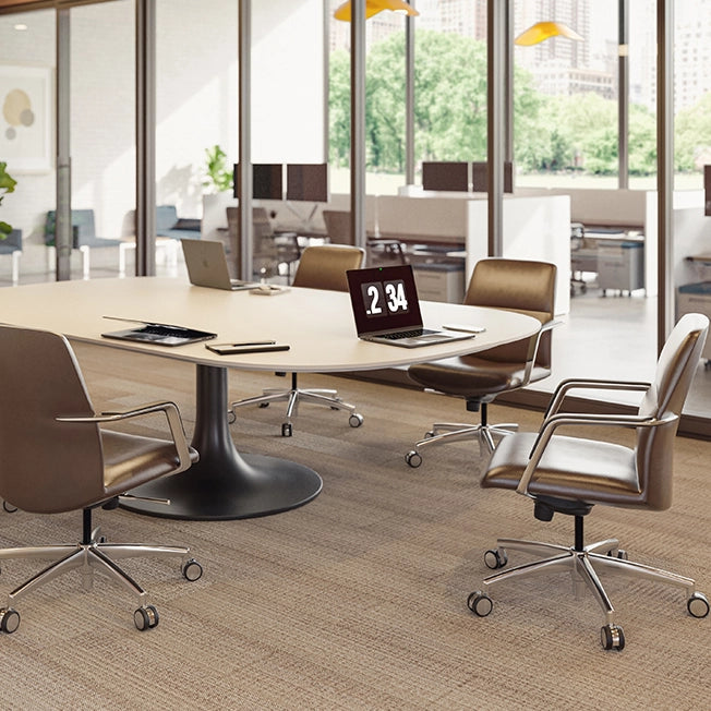 Modern office conference room with a round table and chairs. Kansas City Office Design