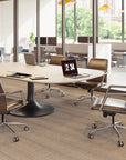 Modern office conference room with a round table and chairs. Kansas City Office Design