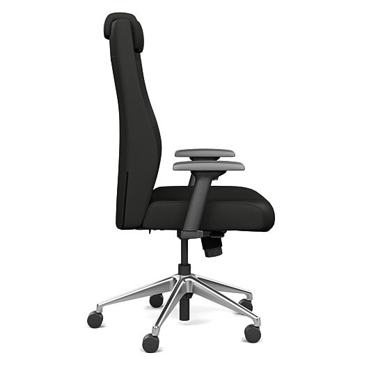 Side view of the SitOnIt Prava highback chair with a headrest in brushed aluminum frame and black vinyl fabric. Kansas City Office Design