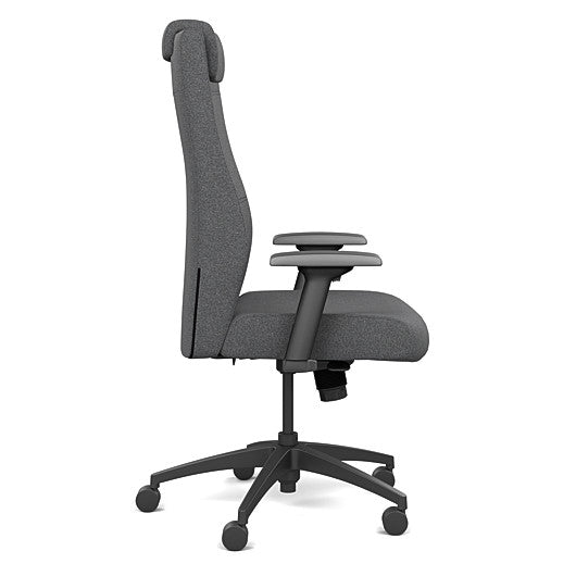 Side view of the SitOnIt Prava highback chair with a headrest in black frame and gray fabric. Kansas City Office Design