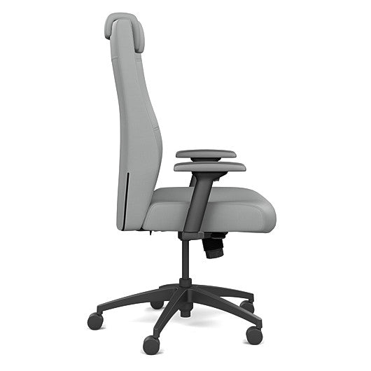 Side view of the SitOnIt Prava highback chair with a headrest in black frame and Platinum Vinyl fabric. Kansas City Office Design