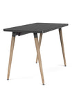 Side view of the SitOnIt Reya Office Desk with Angled Legs. The legs are tapered Bamboo with a black top. Kansas City Office Furniture