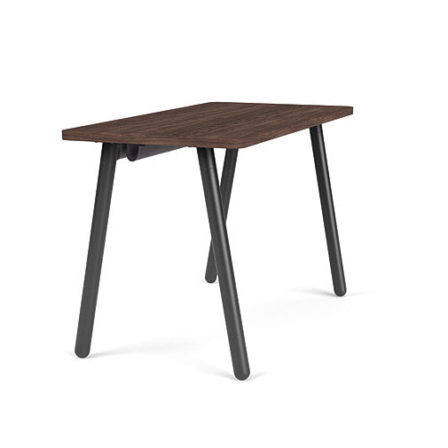 Side view of the SitOnIt Reya Office Desk with Angled Metal Legs. The legs are black with a walnut top. Kansas City Office Furniture