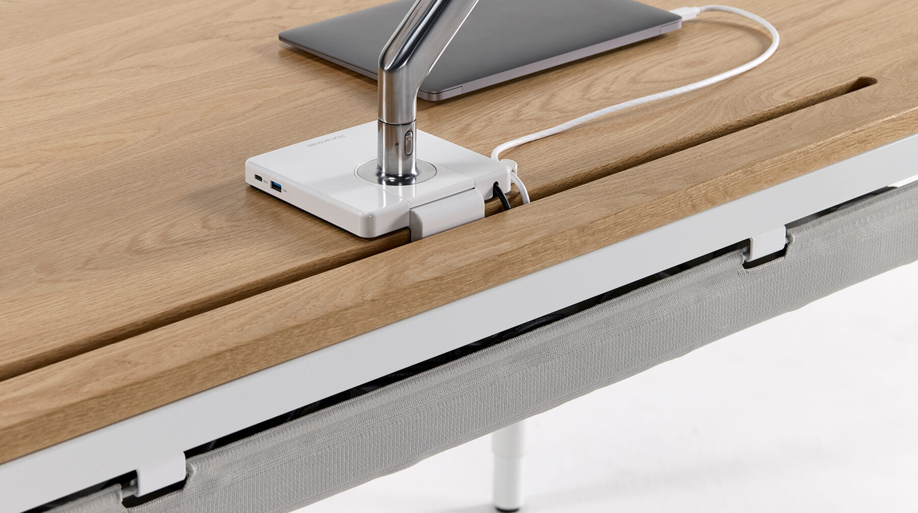 Humanscale eFloat Quattro desk grommet hole for cord and monitor arm management. Kansas City Office Design.