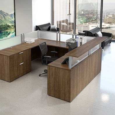 Modern office reception desk setup with a view of mountains and cityscape. Kansas City Office Design