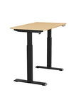 Side view of the SitonIt Switchback Height Adjustable Sit-to-Stand Desk. It has a Black base with a 24"D x 42"W Maple top - Kansas City Office Furniture