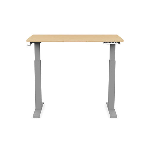 Front view of the SitonIt Switchback Height Adjustable Sit-to-Stand Desk. It has a Silver base with a 24"D x 42"W Maple top - Kansas City Office Furniture