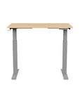 Front view of the SitonIt Switchback Height Adjustable Sit-to-Stand Desk. It has a Silver base with a 24"D x 42"W Maple top - Kansas City Office Furniture