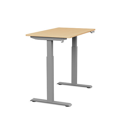Side view of the SitonIt Switchback Height Adjustable Sit-to-Stand Desk. It has a Silver base with a 24"D x 42"W Maple top - Kansas City Office Furniture