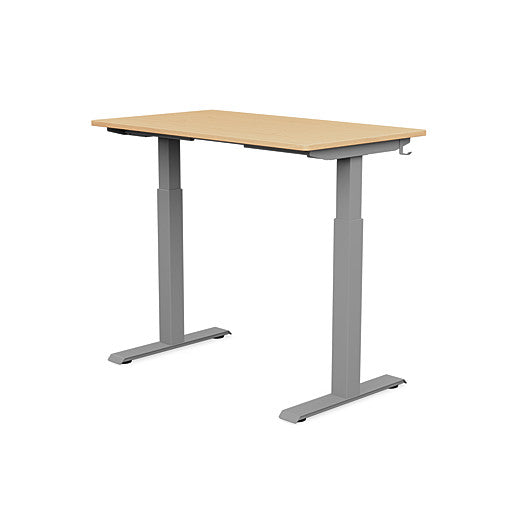 Back view of the SitonIt Switchback Height Adjustable Sit-to-Stand Desk. It has a Silver base with a 24"D x 42"W Maple top - Kansas City Office Furniture