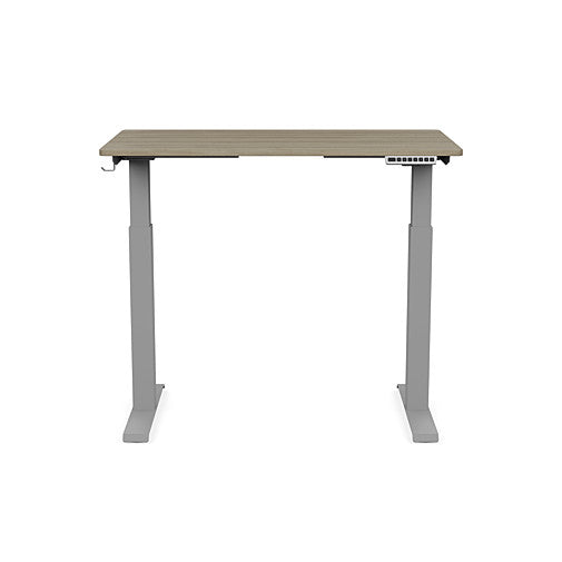 Front view of the SitonIt Switchback Height Adjustable Sit-to-Stand Desk. It has a Silver base with a 24"D x 42"W Sandalwood top - Kansas City Office Furniture