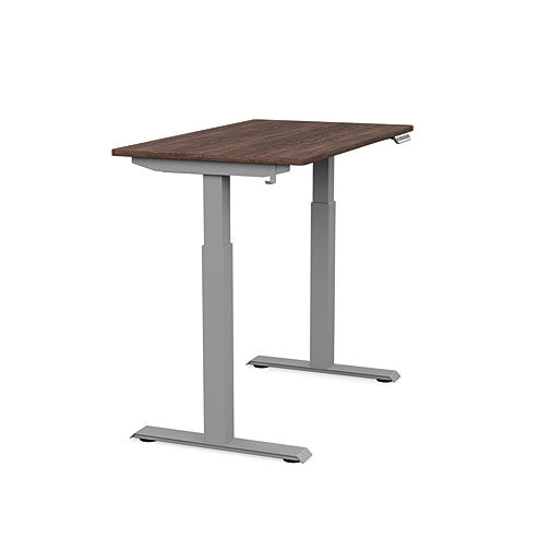 Side view of the SitonIt Switchback Height Adjustable Sit-to-Stand Desk. It has a Silver base with a 24"D x 42"W Walnut top - Kansas City Office Furniture
