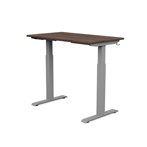 Back view of the SitonIt Switchback Height Adjustable Sit-to-Stand Desk. It has a Silver base with a 24"D x 42"W Walnut top - Kansas City Office Furniture
