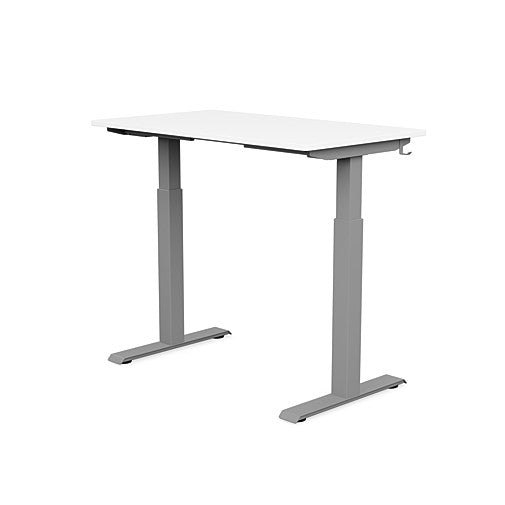 Back view of the SitonIt Switchback Height Adjustable Sit-to-Stand Desk. It has a Silver base with a 24"D x 42"W White top - Kansas City Office Furniture