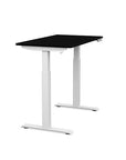 Side view of the SitonIt Switchback Height Adjustable Sit-to-Stand Desk. It has a White base with a 24"D x 42"W Black top - Kansas City Office Furniture