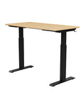 Back view of the SitonIt Switchback Height Adjustable Sit-to-Stand Desk. It has a Black base with a 24"D x 48"W Maple top - Kansas City Office Furniture