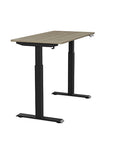 Side view of the SitonIt Switchback Height Adjustable Sit-to-Stand Desk. It has a Black base with a 24"D x 48"W Sandalwood top - Kansas City Office Furniture