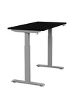 Side view of the SitonIt Switchback Height Adjustable Sit-to-Stand Desk. It has a Silver base with a 24"D x 48"W Black top - Kansas City Office Furniture