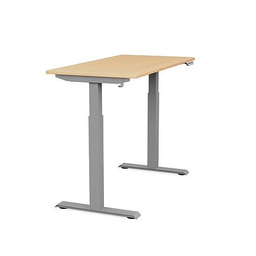 Side view of the SitonIt Switchback Height Adjustable Sit-to-Stand Desk. It has a Silver base with a 24"D x 48"W Maple top - Kansas City Office Furniture