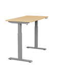 Side view of the SitonIt Switchback Height Adjustable Sit-to-Stand Desk. It has a Silver base with a 24"D x 48"W Maple top - Kansas City Office Furniture