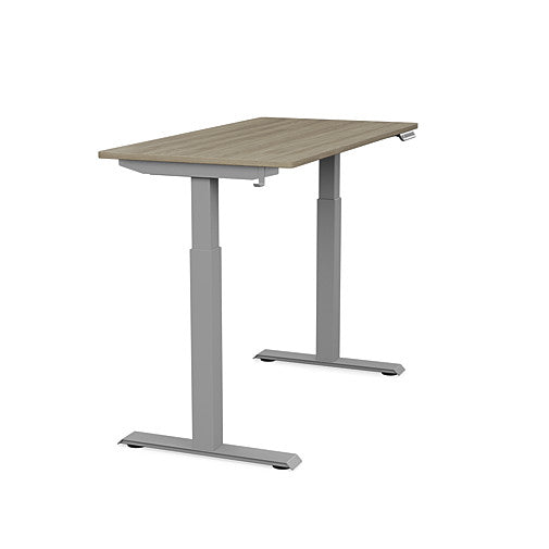 Side view of the SitonIt Switchback Height Adjustable Sit-to-Stand Desk. It has a Silver base with a 24"D x 48"W Sandalwood top - Kansas City Office Furniture