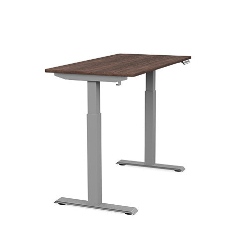 Side view of the SitonIt Switchback Height Adjustable Sit-to-Stand Desk. It has a Silver base with a 24"D x 48"W Walnut top - Kansas City Office Furniture