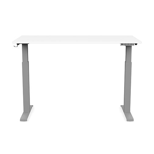 Front view of the SitonIt Switchback Height Adjustable Sit-to-Stand Desk. It has a Silver base with a 27"D x 54"W White top - Kansas City Office Furniture