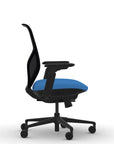 Side view of the 9to5 Tori Midback ergonomic task chair in black frame, blue fabric, and black mesh. Kansas City Office Design.