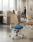 Open office with big windows in a modern office with cubicles and task chairs. Kansas City Office Design.