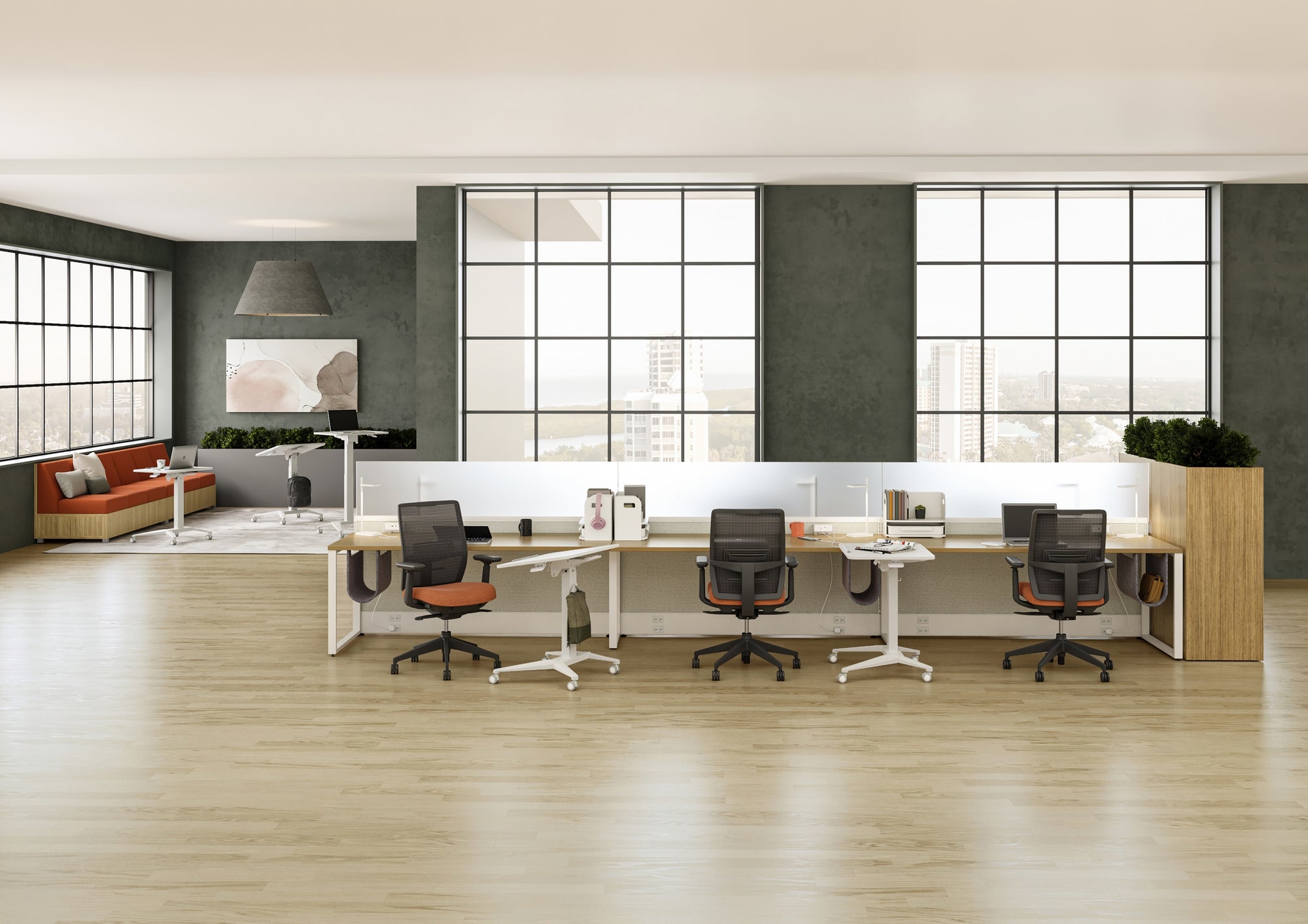 Modern office space with desks, chairs, and large windows. Kansas City Office Design.