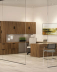 Modern office interior with wooden furniture, glass walls, and a painting on the wall. Kansas City Office Design.