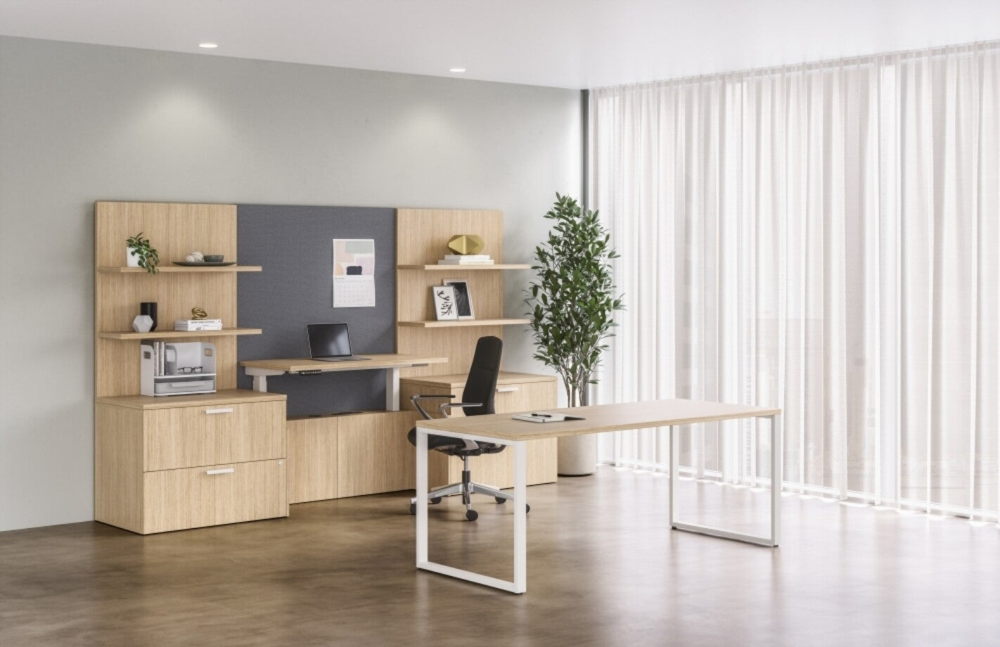 Modern office setup with a L-shaped desk, shelves, and a plant. AIS Auburn Executive Chair. Kansas City Office Design