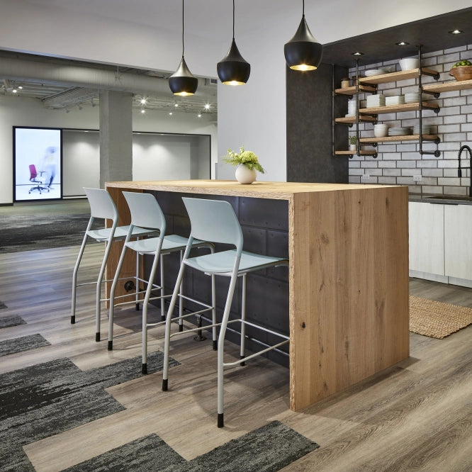 Modern kitchen with wooden island and AIS Pierce barstools in a stylish interior setting. Kansas City Office Design